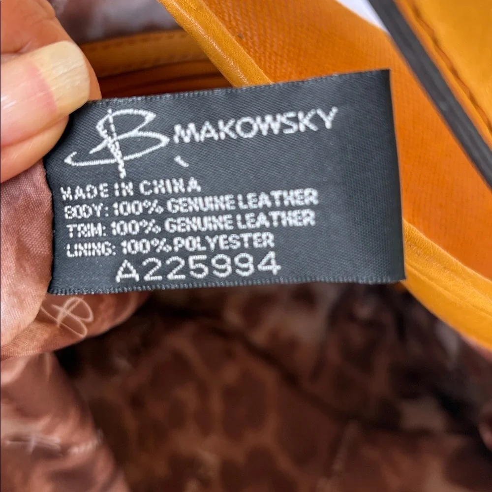 B. Makowsky Orange Hobo Bag